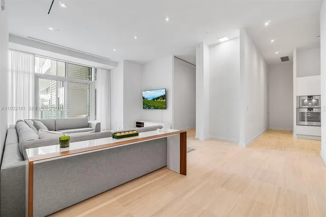 a kitchen with stainless steel appliances a sink stove and cabinets