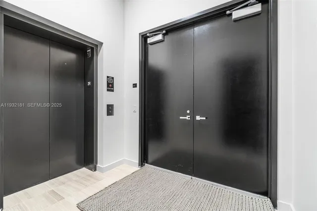 a bathroom with a shower and a sink