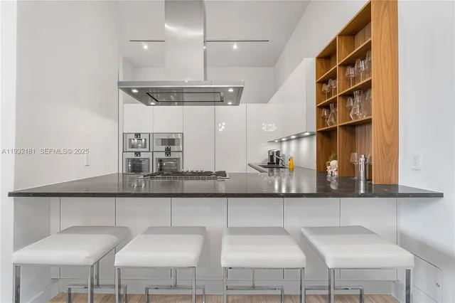 a kitchen with a table and chairs in it