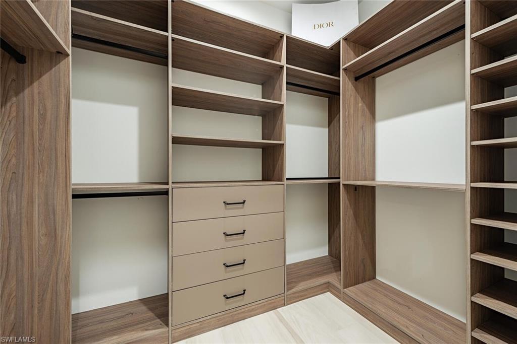 662 9th Street Southwest Naples, FL 34117 - Photo 18 of 34 a view of walk in closet with empty racks