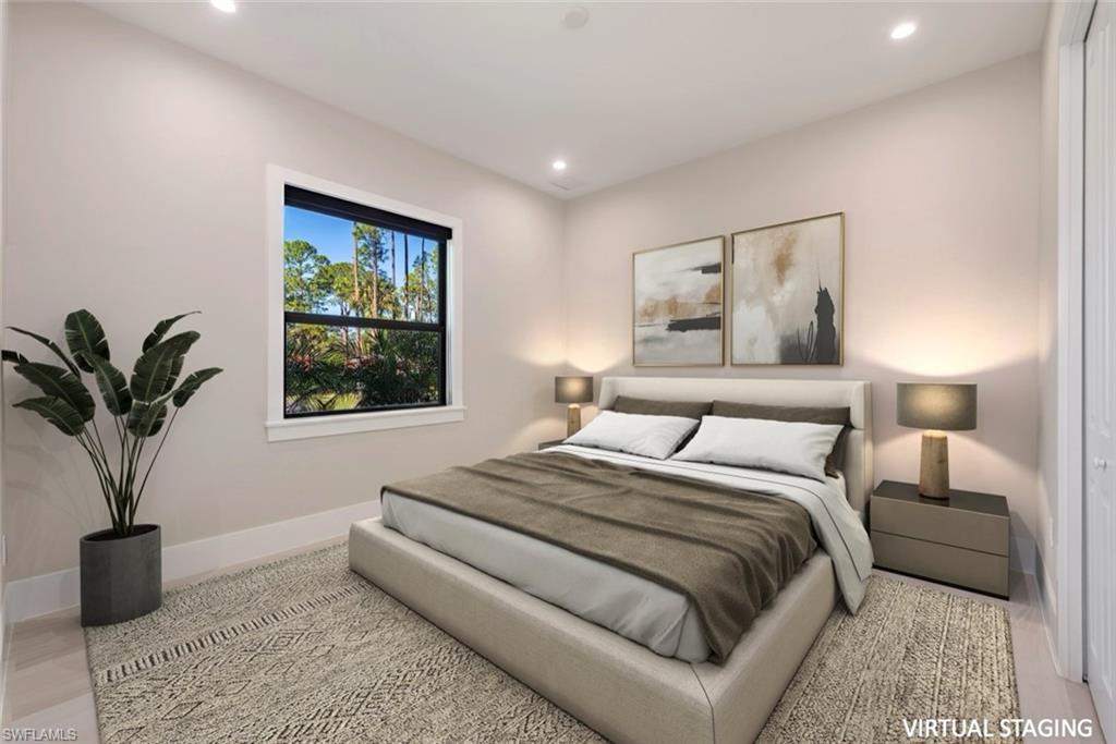 662 9th Street Southwest Naples, FL 34117 - Photo 26 of 34 a bedroom with a large bed and a potted plant