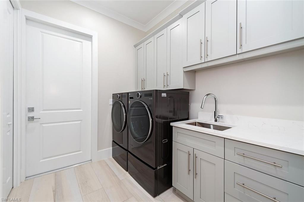 662 9th Street Southwest Naples, FL 34117 - Photo 28 of 34 a utility room with cabinets