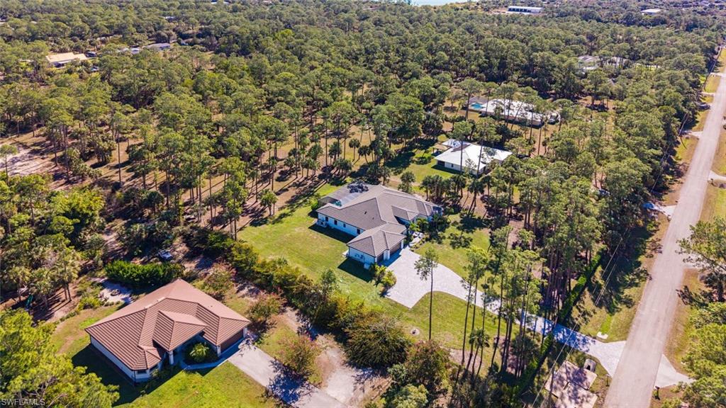 662 9th Street Southwest Naples, FL 34117 - Photo 31 of 34 an aerial view of residential house with swimming pool and green space