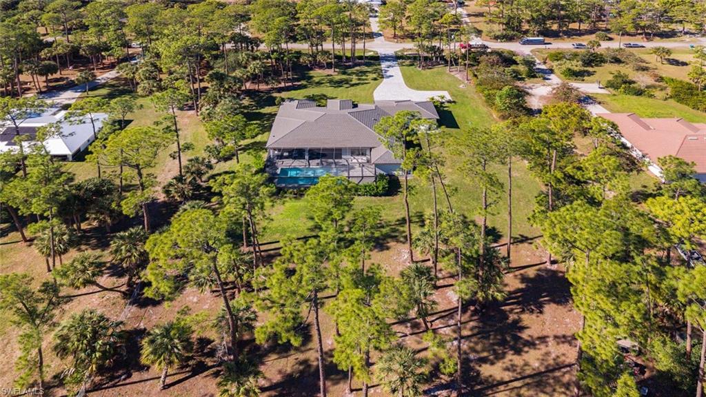 662 9th Street Southwest Naples, FL 34117 - Photo 32 of 34 an aerial view of house with yard
