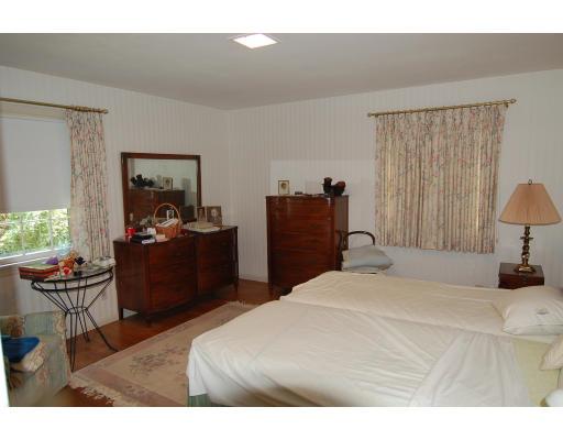 101 Chalmers Street Springfield, MA 01118 - Photo 13 of 19 a bedroom with a bed and wooden floor