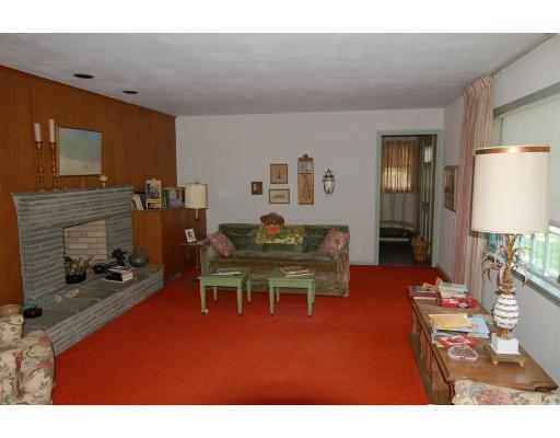 101 Chalmers Street Springfield, MA 01118 - Photo 6 of 19 a living room with furniture a dining table and a fireplace