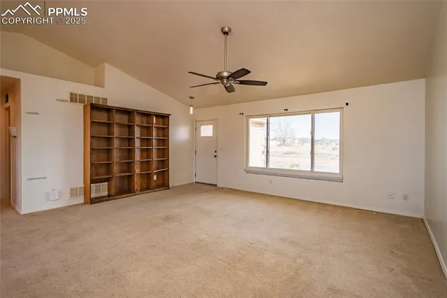 en view of an empty room with a window