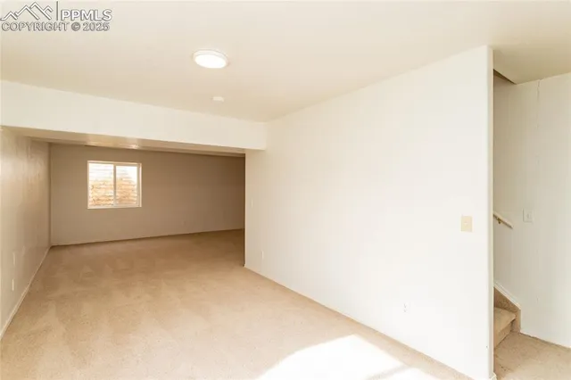 a view of an empty room and window