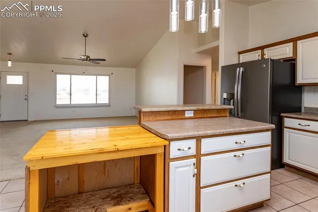 a kitchen with a stove and a refrigerator