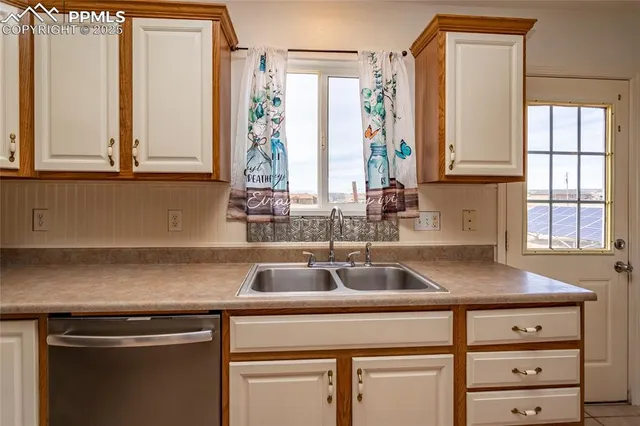 a kitchen with a sink and a window