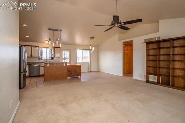 a view of a kitchen with cabinet and a kitchen view