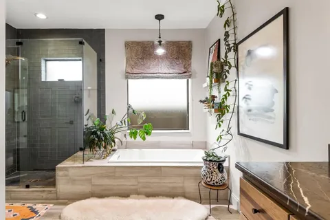 a bathroom with double sink and a mirror