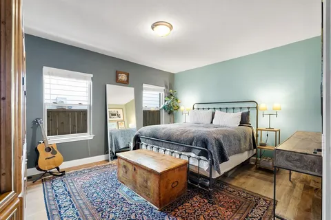 a balcony with furniture and a potted plant