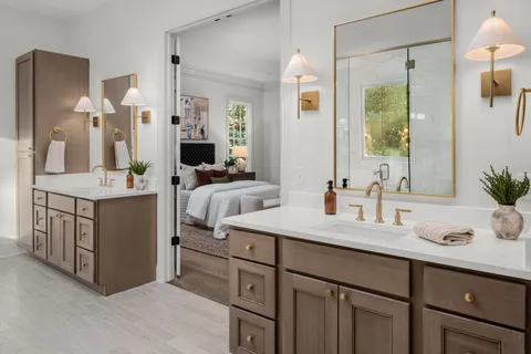 a bathroom with a double vanity sink and a mirror