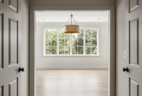 an empty room with wooden floor