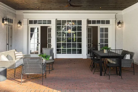 a view of a patio with couches chairs and a table