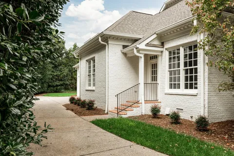 a view of a garage with a backyard