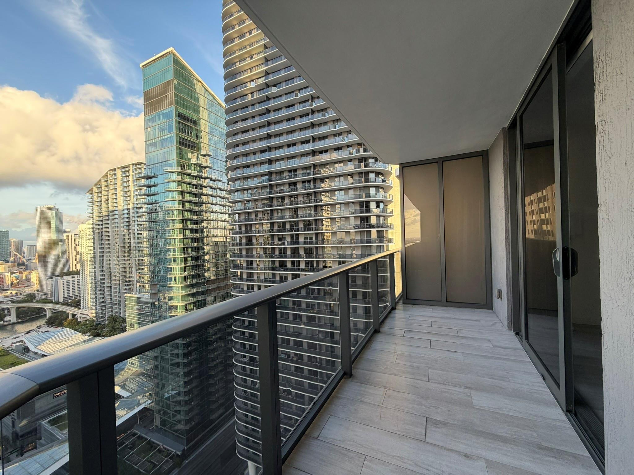 45 Southwest 9th Street, Unit 3110 Miami, FL 33130 - Photo 5 of 19 a view of balcony with wooden floor