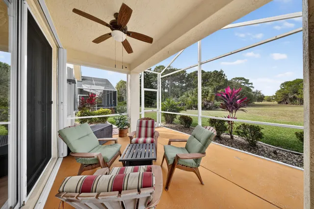 a balcony with furniture and garden view