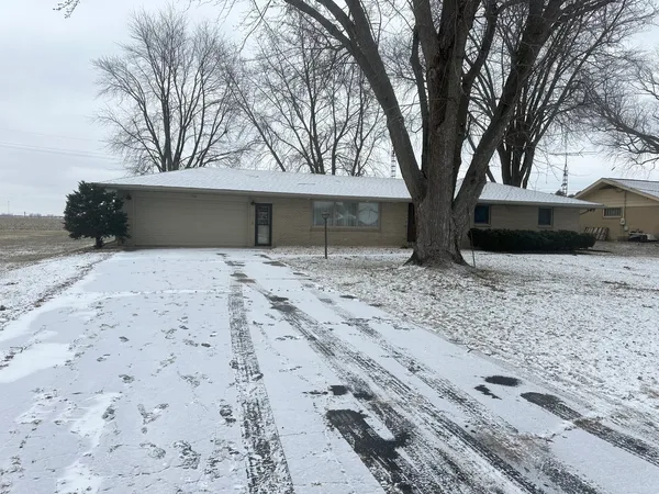 a backyard of a house with large trees