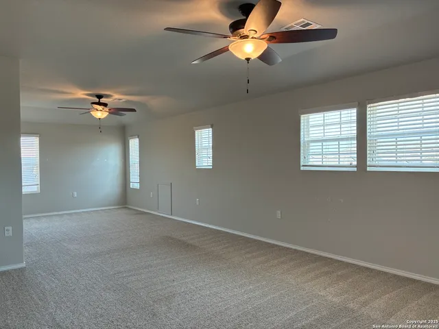 a view of empty room with windows