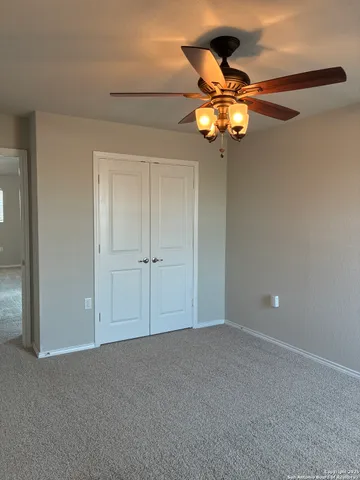 a view of a chandelier fan in a room
