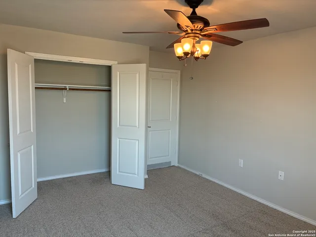 a view of walk in closet and bedroom view