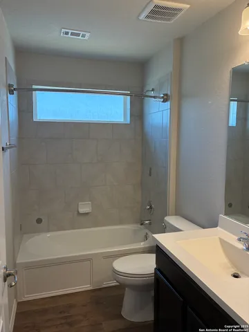 a view of a swimming pool with a patio