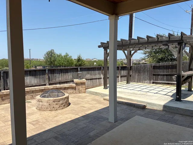 a view of a swimming pool with a patio