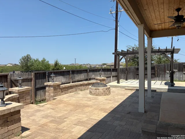 a view of swimming pool with lake and couches in the back