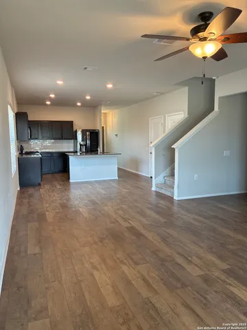 a view of a kitchen with a sink and a microwave