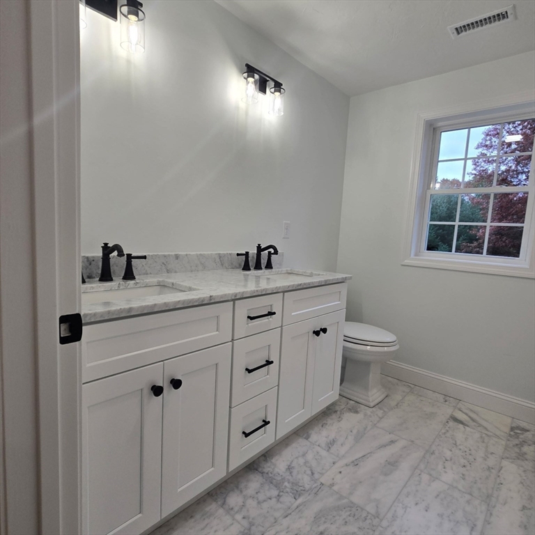37 Tarkiln Road Kingston, MA 02364 - Photo 27 of 42 a bathroom with a toilet sink and mirror