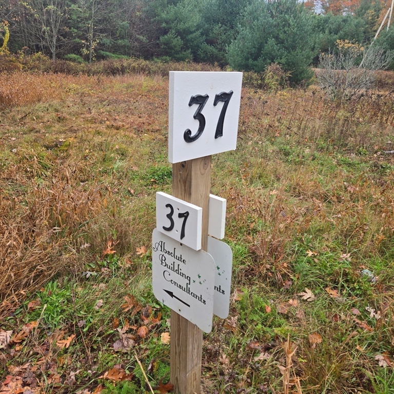 37 Tarkiln Road Kingston, MA 02364 - Photo 4 of 42 a sign broad on the side of a road