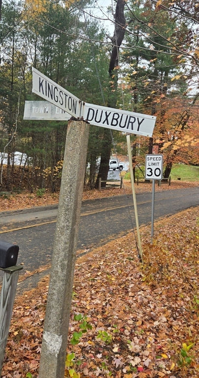 37 Tarkiln Road Kingston, MA 02364 - Photo 42 of 42 a view of a street sign under a large tree