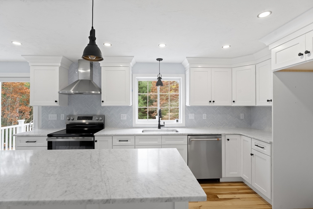 37 Tarkiln Road Kingston, MA 02364 - Photo 7 of 42 a kitchen with granite countertop a stove and a sink