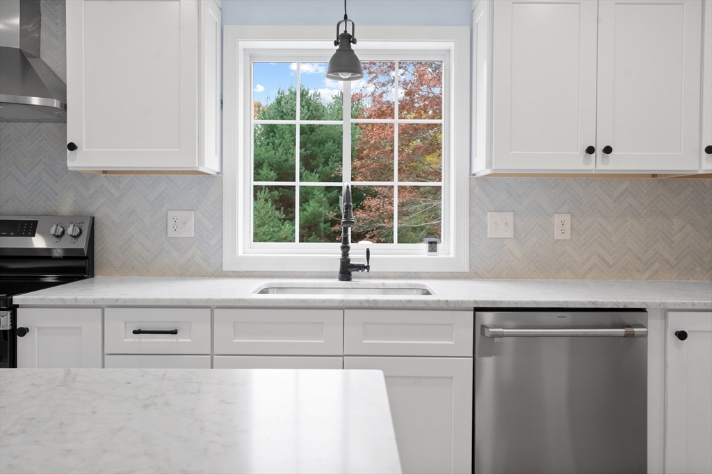 37 Tarkiln Road Kingston, MA 02364 - Photo 8 of 42 a kitchen with a sink and cabinets