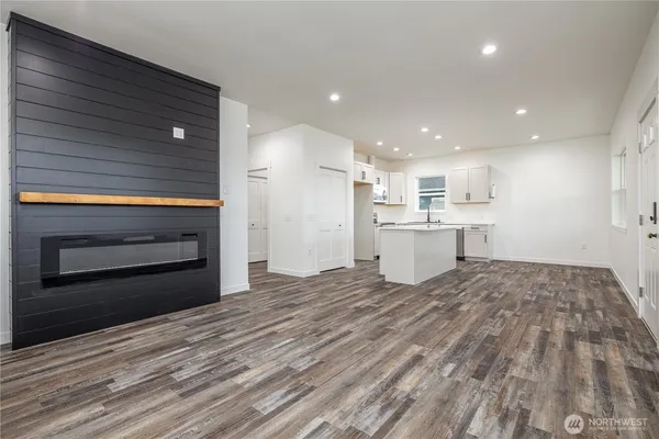 a view of kitchen and empty room