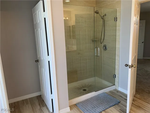 a bathroom with a shower and a toilet