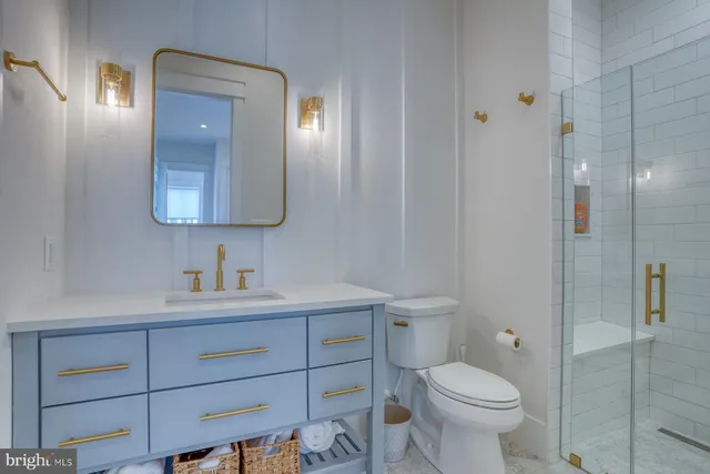 a bedroom with a bed and a table in it with window