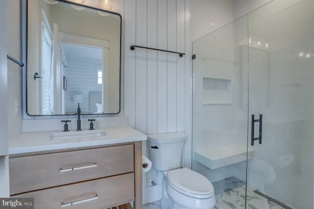 a bathroom with a double vanity sink and mirror