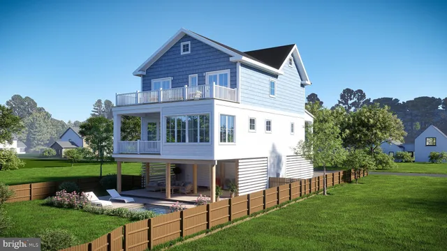 an aerial view of a house with garden space and a lake view