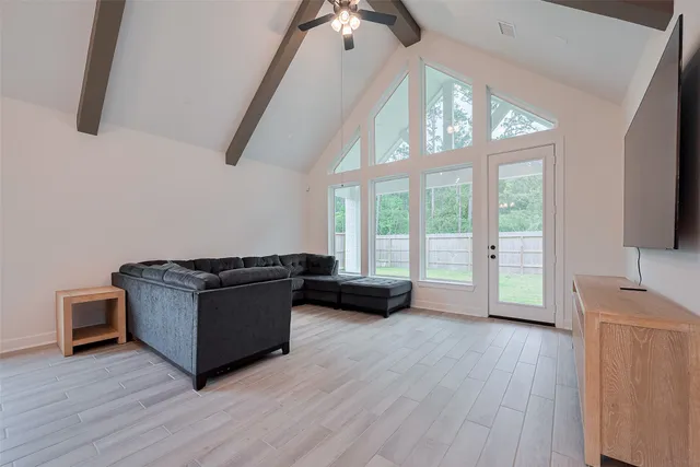 a view of an empty room with a potted plant