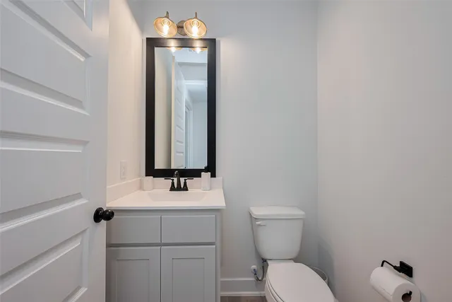 a bedroom with a bed and a ceiling fan