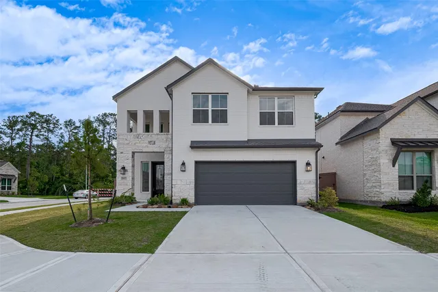 a view of staircase with wooden floor and white walls