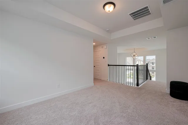 a en suite bathroom with a double vanity sink and a mirror