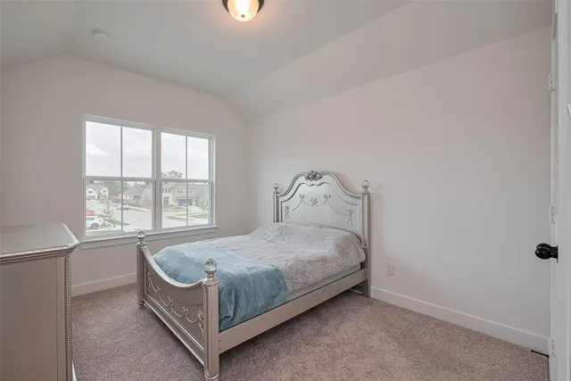a view of a house with wooden floor and a large window