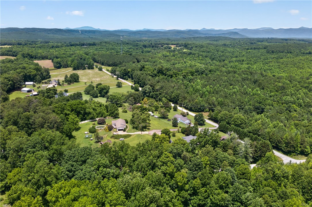 103 Dorsey Lane Walhalla, SC 29691 - Photo 41 of 42 Discover vast, rolling acreage with scattered homes and dense forests extending to distant mountains.