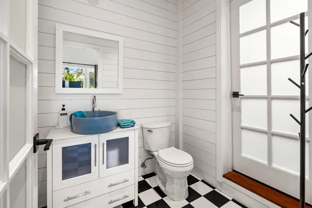 a bathroom with a toilet and a sink