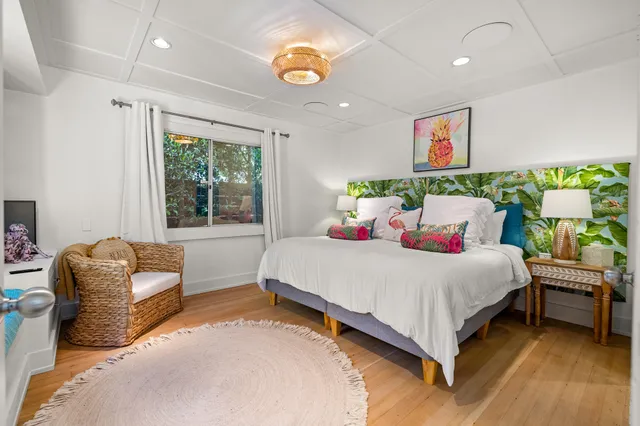 a bedroom with a bed and a couch