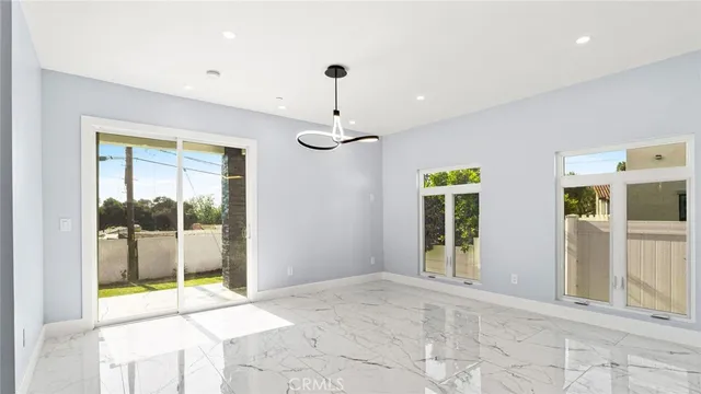 a view of an entryway with a chandelier